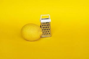 Fresh lemons isolated on a yellow background. photo