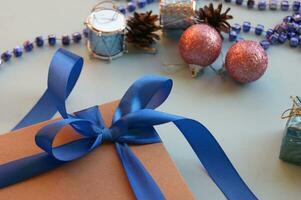 Christmas gift craft box on a blue background with decoration. photo