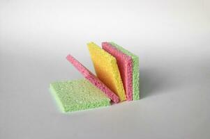 Bright colored sponges for washing dishes, cleaning the bathroom and other household needs. photo