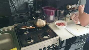 Time lapse of the man preparing ste like dish, made of meat and vegetables. Food video