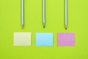 Three blank stickers and colorful pencils. Place for text. photo