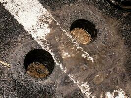 holes in asphalt roads due to core drilling photo