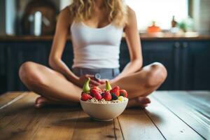 AI generated Healthy breakfast. Cropped image of young woman sitting in the kitchen at home, Athletic woman eating a healthy bowl of muesli with fruit sitting on floor in the kitchen at home photo