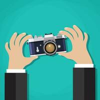 Flat illustration of photo camera with hand holding it vector