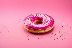 ai generado un rosquilla con rosado Formación de hielo y asperja en un rosado antecedentes foto