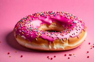 AI generated a donut with pink icing and sprinkles on a pink background photo