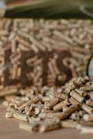 Pile of pellets with bag of granules in the background photo