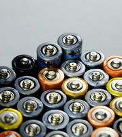 Salt and alkaline batteries, source of energy for portable technology. AAA and AA batteries photo