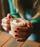 A cup of Italian-style coffee with milk ideal for the Christmas season photo