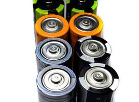 Salt and alkaline batteries, source of energy for portable technology. AAA and AA batteries photo