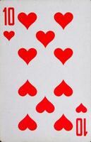 Playing card of a dozen of hearts, suit of hearts. photo