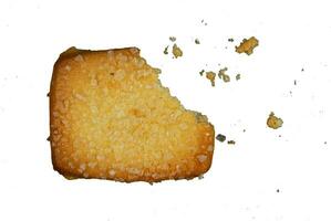 bite biscuit with crumbs isolated photo
