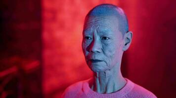 Old Japanese Woman on a Neon-Lit Street video