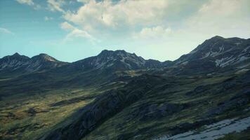 A breathtaking view of a majestic mountain range from the top of a hill video