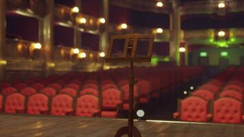 An empty theatre with rows of red chairs video