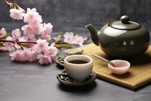 AI generated Traditional ceremony. Cups of brewed tea, teapot and sakura flowers on grey table. Generative AI photo