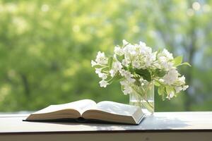 AI generated Jasmine flowers in a vase and open book on the table, green natural background. AI Generated photo