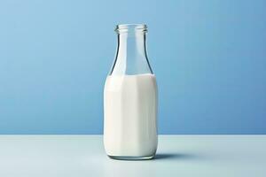 AI generated A glass bottle with full milk on blue background. AI Generated photo