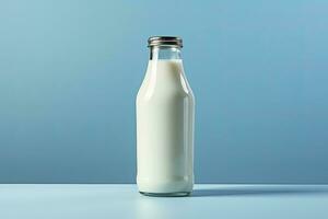 AI generated A glass bottle with full milk on blue background. AI Generated photo