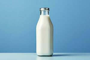 AI generated A glass bottle with full milk on blue background. AI Generated photo