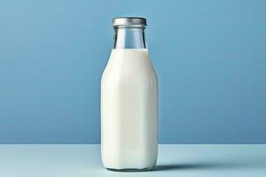 AI generated A glass bottle with full milk on blue background. AI Generated photo