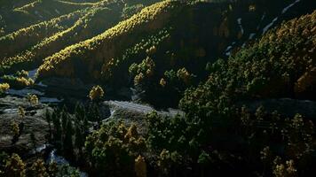 An aerial view of a valley with a river running through it video