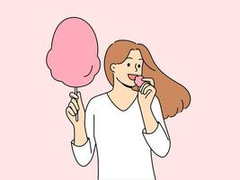 Woman eats cotton candy, enjoying airy sugar dessert while walking in park or at fair. Carefree girl holding cotton candy and experiencing positive emotions from lack of important things to do vector