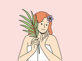 Woman with sprig of medicinal plant used for cosmetic purposes, stands in bath towel and rejoices at effect of using cream. Woman recommends using eco-masks and creams based on organic herbs vector