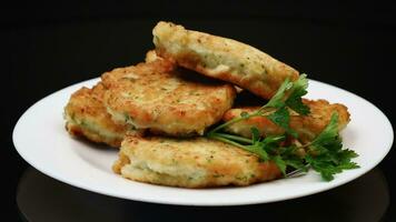 cooked fried potato cutlets with herbs video