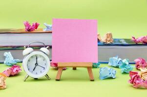 A small easel with a blank sticker on the background of the educational installation. photo
