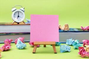 A small easel with a blank sticker on the background of the educational installation. photo