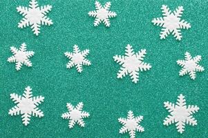 White carved snowflakes of mastic on blue background. Winter holiday. photo