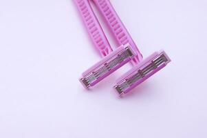 Man and woman body treatment of depilation with razor and skin care concept. photo