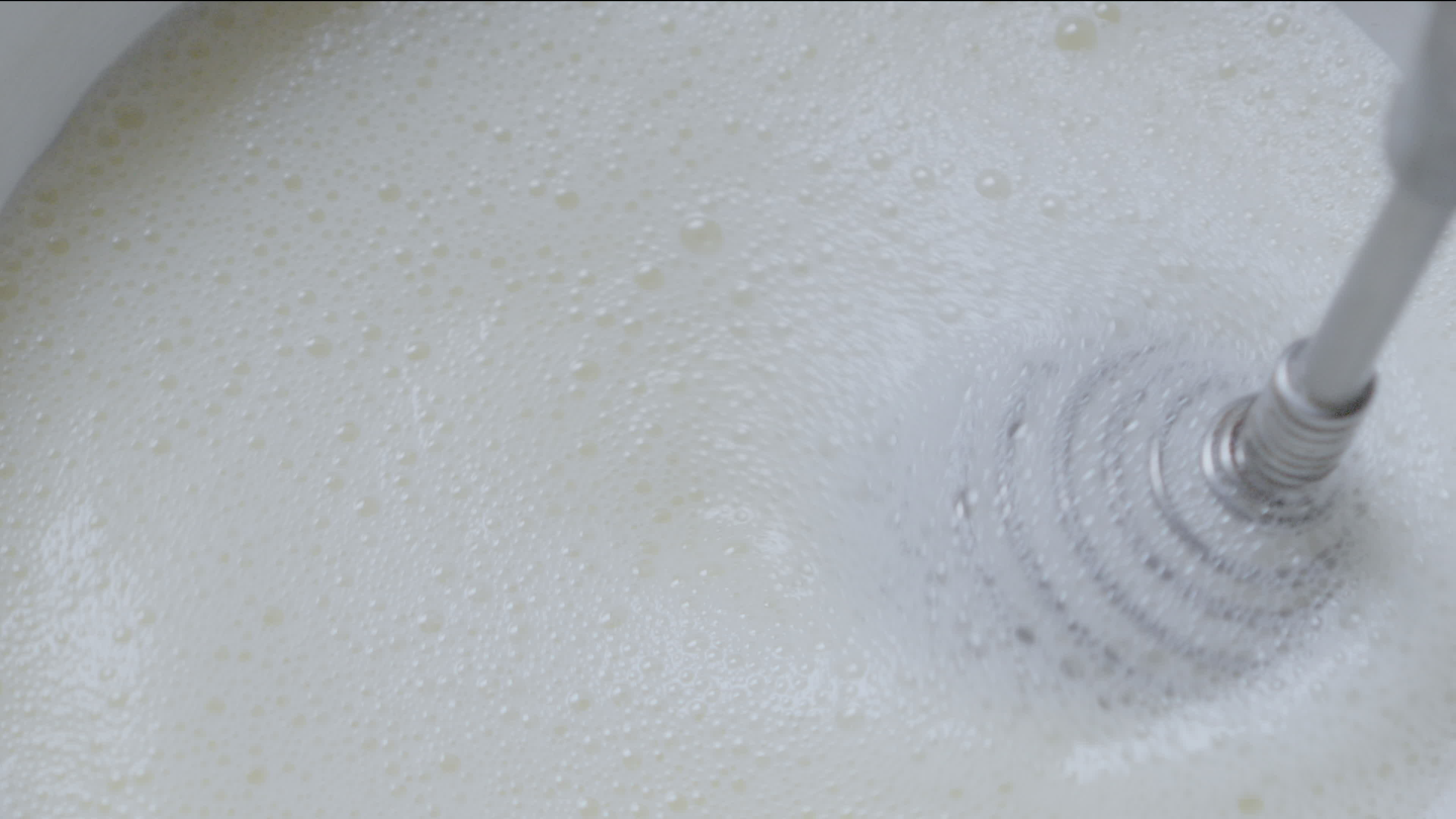 Whipping cream using hand whisk, closeup. 36018549 Stock Video at Vecteezy