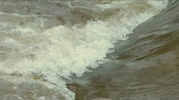 Flow of water with mud and foam during heavy rain video