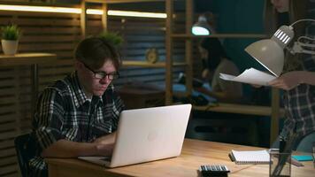 Creative Business Team, Business Project, Hipster Businessmen, Remote Work, Freelance Working. Two businessmen during a brainstorming session are sitting at a table in an office video