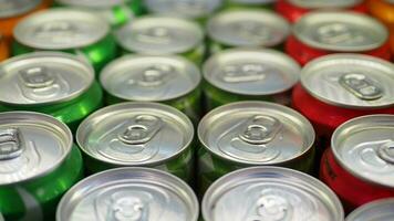 Cans of soft drink lined up , video