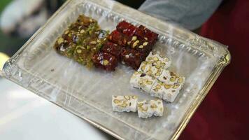 men serving Turkish traditional sweet Turkish delight video