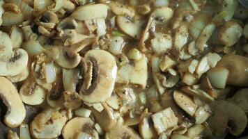 top view of cooking mushroom in a cooking pan video