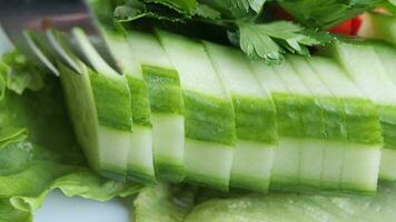 close up of slice of cucumber in a bowl on table video