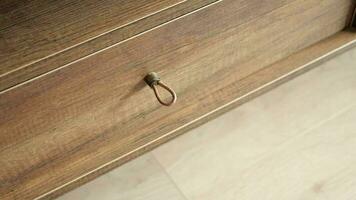 man's hand open drawer wooden in cabinet video