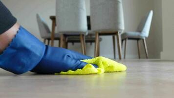 A man's hand washing the floor with a cloth video