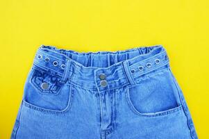 Flat lay, denim jeans leg seam detail, background texture. photo