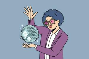 Funny man with disco ball with curly wig on head came to nightclub or dance floor to have fun and relax. Young guy enjoys atmosphere of music festival or disco party for party people vector