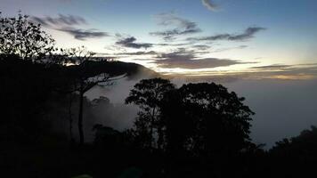 Flying Over the Clouds at Morning Sunrise in the Mountains video