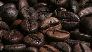 Rotating shot of delicious roasted coffee beans. Close up. Texture of coffee beans. 4K video