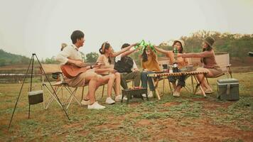 Group of young  Asian people are enjoy camping in natural campsite video