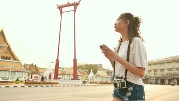 Beautiful young Asian tourist woman on vacation sightseeing and exploring Bangkok city, Thailand, Holidays and traveling concept video