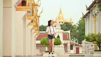 Beautiful young Asian tourist woman on vacation sightseeing and exploring Bangkok city, Thailand, Holidays and traveling concept video