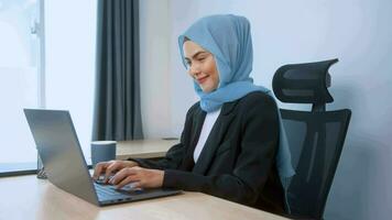 young muslim business woman working at home video